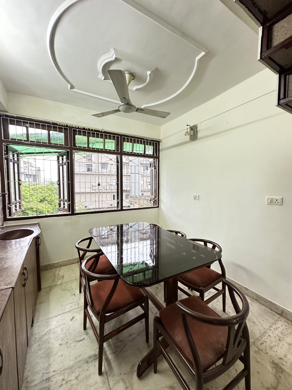 Resident Dining Space with Glass-Top Table